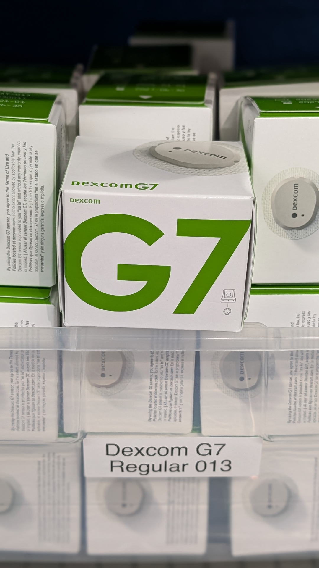 Factory-sealed Dexcom G7 CGM boxes on a pharmacy shelf